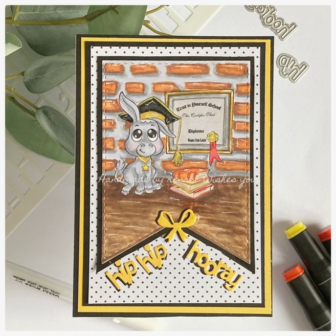 Handmade graduation card featuring a donkey with a graduation hat, standing in front of a yellow and grey board on the background. The card includes the sentiment 'Trust Yourself School Diploma' on a yellow and grey board.